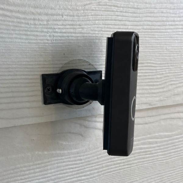 Blink Video Doorbell 1st Gen on adjustable 15–90 degree swivel mount — siding installation, right-facing view