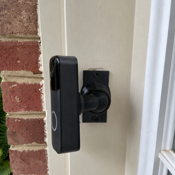 Blink Video Doorbell 1st Gen on adjustable 15–90 degree swivel mount — brick and trim installation, left-facing view
