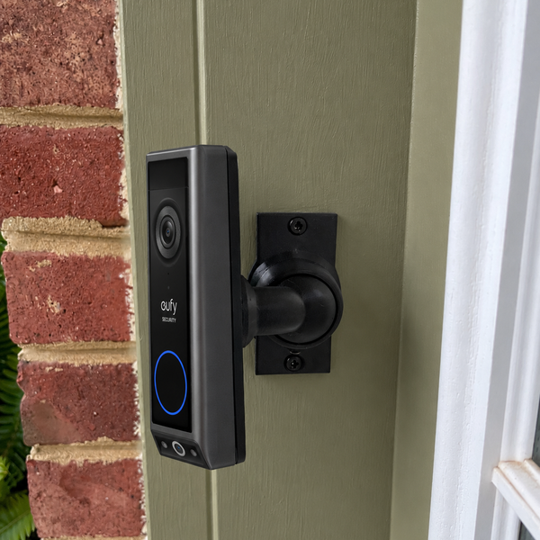 Eufy E340 dual-camera video doorbell on adjustable 90 degree swivel mount, left-facing installation