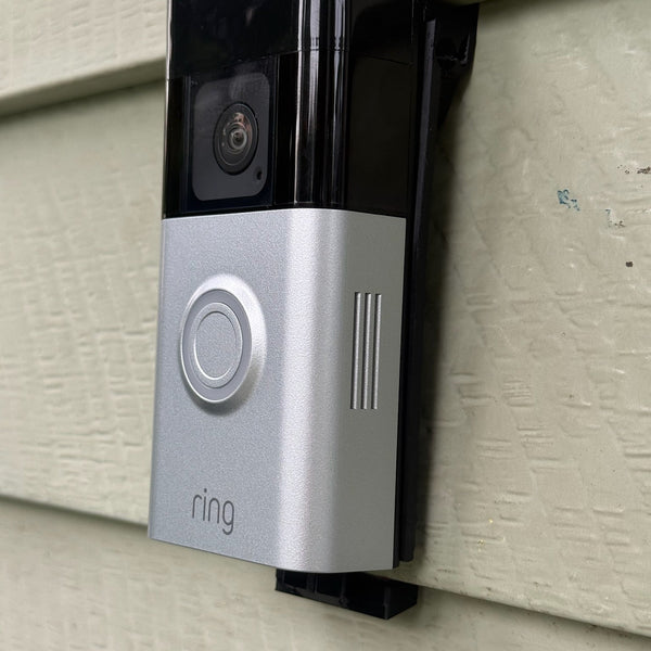 No-drill aluminum siding mount for video doorbells shown on aluminum lap siding with a Ring doorbell
