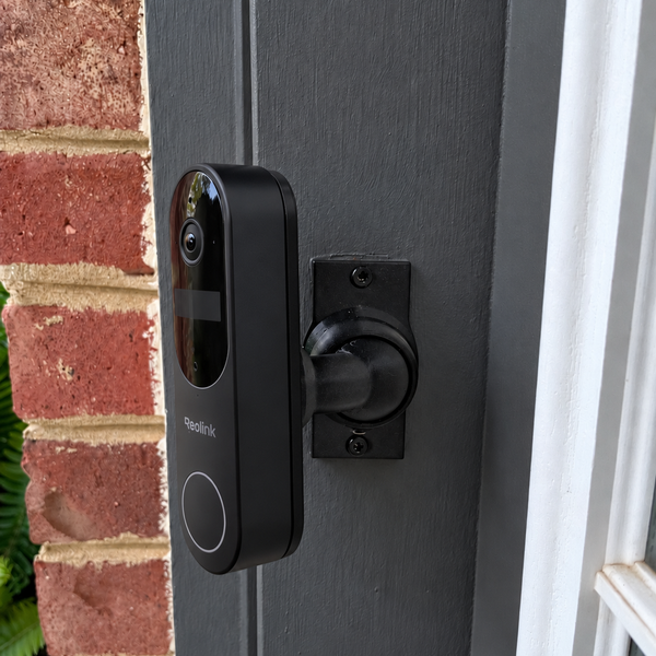 Reolink Video Doorbell Battery first generation installed on 15–90 degree adjustable swivel mount, left-facing installation