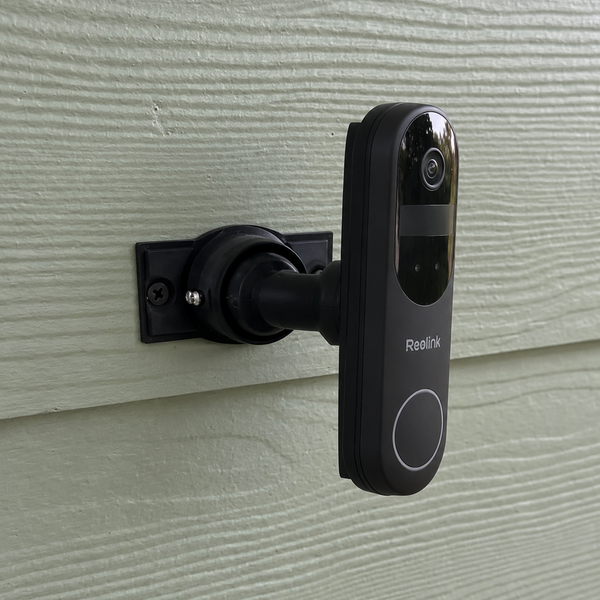 Reolink Video Doorbell Battery first generation installed on 15–90 degree adjustable swivel mount, right-facing installation