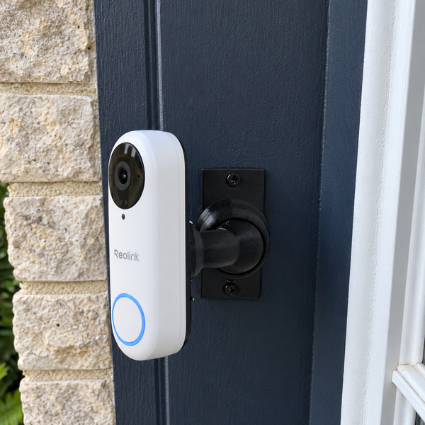 Reolink Video Doorbell PoE white installed on 15–90 degree adjustable swivel mount, left-facing installation