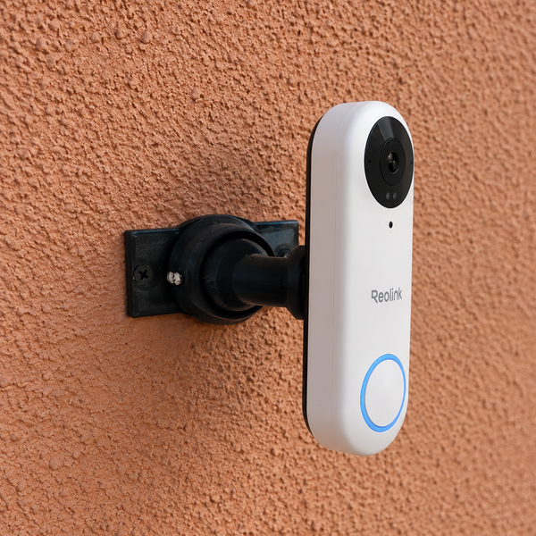 Reolink Video Doorbell PoE white installed on 15–90 degree adjustable swivel mount, right-facing installation